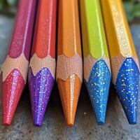Colorful arrangement of pencils showcasing vibrant hues on a clean surface photo