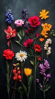 Colorful bouquet of various flowers arranged on dark background capturing the beauty of nature photo