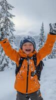 A young boy in an orange jacket and backpack is smiling photo
