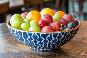 A bowl of fruit on a table photo