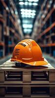 A hard hat sitting on top of a pallet in a warehouse photo