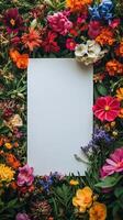 Colorful floral arrangement with blank paper in the center for creative projects and designs. photo