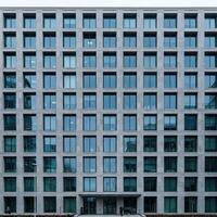 A large building with many windows on the side photo