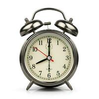 An alarm clock, is shown on a white background photo