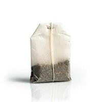 A bag of tea is shown on a white surface photo