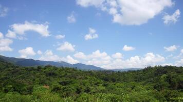 Lush Green Mountain Landscape, Sunny Sky, Clouds photo