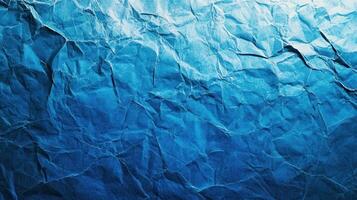 Crumpled paper background with blue color photo