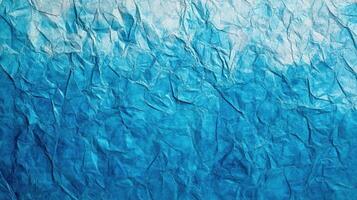 Blue crumpled paper texture background photo
