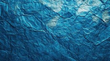 Crumpled blue paper texture, abstract background, design element photo