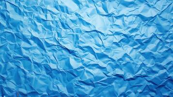 Crumpled blue paper texture, studio shot, background blur, design element photo