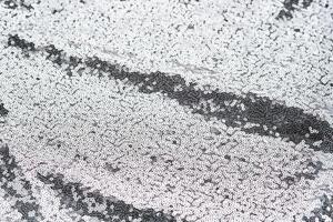 Abstract festive fabric texture with silver sequins. photo