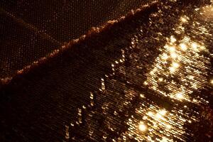 Abstract festive gold background made of sequins. photo