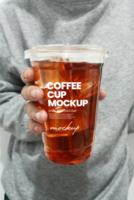 Man holding cup of coffee on plain background front view psd