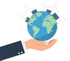 A hand holding a globe with solar panels and wind turbines in a flat illustration vector
