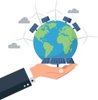 Hand holding a globe surrounded by solar panels and wind turbines in flat art vector