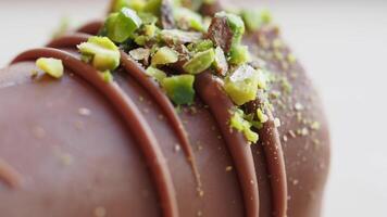 Chocolate dessert with pistachio topping in close-up view video