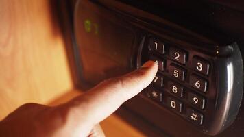 Unlocking a safe using a keypad in a quiet room video