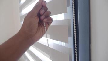 Adjusting window blinds for natural light control and privacy video
