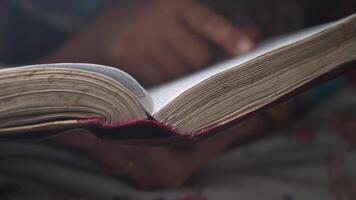 Exploring the pages of a book in a quiet setting video
