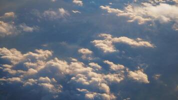 Cloud patterns viewed from above during flight at sunset video