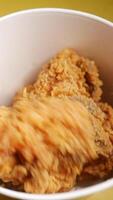 Crispy fried chicken pieces in a takeout container video