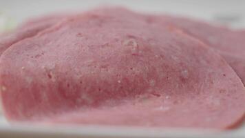 Preparing fresh sliced deli meat in a kitchen setting video