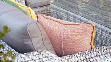 Cozy outdoor seating with textured cushions and wicker furniture video