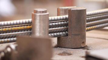 Metalworking with steel rods in a workshop setting video