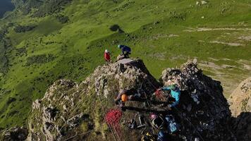 View from the top. climbers on the mountain working with ropes video