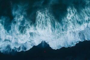 Aerial View of Ocean Waves Crashing on a Black Sand Beach for Nature and Travel Design photo