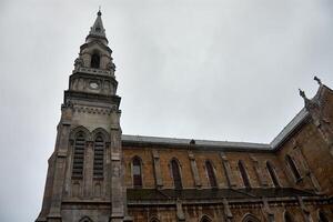 The Church of Santo Tomas de Canterbury in Aviles, Asturias, Spain under cloudy sky photo