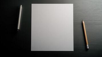 Blank paper, pen and pencil on a black table photo
