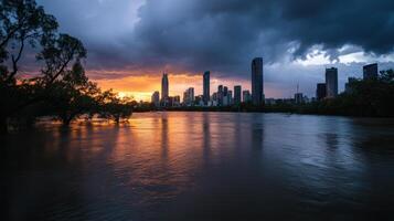 city skyline reflecting in floodwaters under dramatic sunset photo