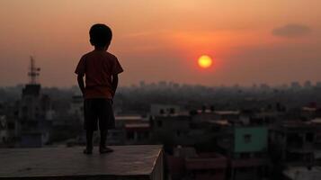 child standing on rooftop, gazing at beautiful sunset over city photo