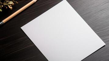 Blank paper on a wooden table with pencil and flowers photo