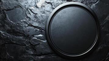 Black round frame on stone wall photo
