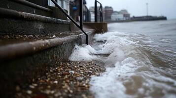 waves crash against steps, showcasing power of nature at shoreline photo