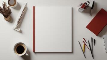 A white desk with a red border and a notebook photo