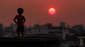 child standing on rooftop, gazing at vibrant sunset over city skyline photo