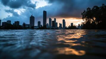 A city skyline is seen through water on a cloudy day photo