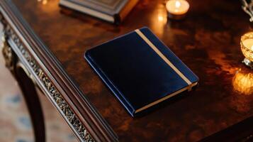 Luxurious velvet covered notebook on elegant wooden table with candles photo