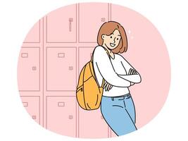 Woman student stands near boxes for personal items in college hallway and looks at screen smiling vector