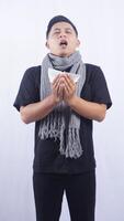 Sick Asian Man Going to Sneeze Into Tissue Paper on White Background photo