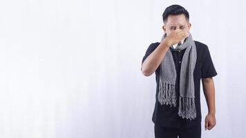 Unhealthy Asian Man Suffering from Flu on White Background photo
