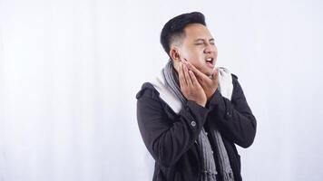 Sick Young Asian Man with Toothache on White Background photo