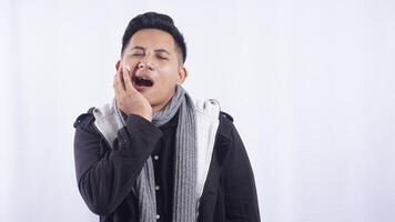 Young Asian Man with Toothache on White Background photo