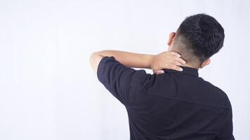 Rear View of Man with Neck Pain on White Background photo