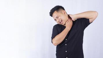 Sick Asian Man Do Self Massage at His Shoulder to Release Pain on White Background photo
