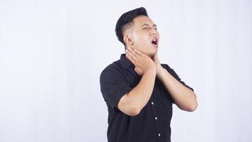 Side View of Young Asian Man with Sore Throat on White Background photo