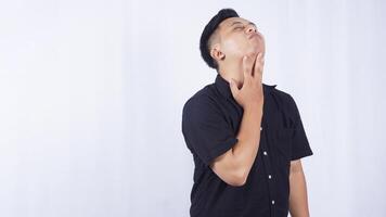 Side View of Young Asian Man with Throat Irritation on White Background photo